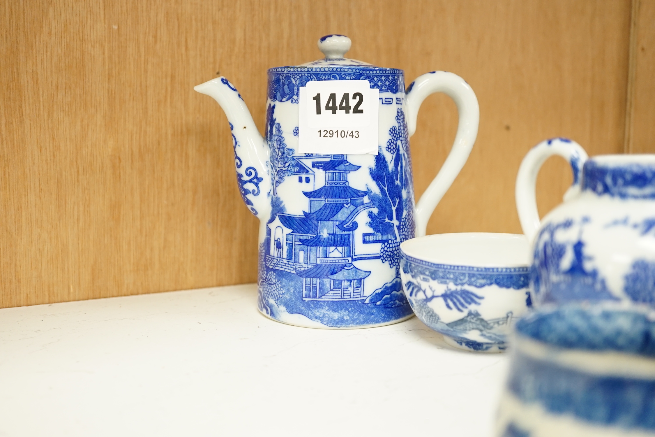 A Japanese blue and white pot coffee set and a 19th century blue and white cheese dish and a Chinese green glass and pewter mounted mug